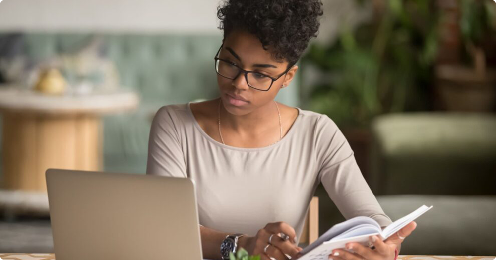 black female landlord reviewing bad renters list