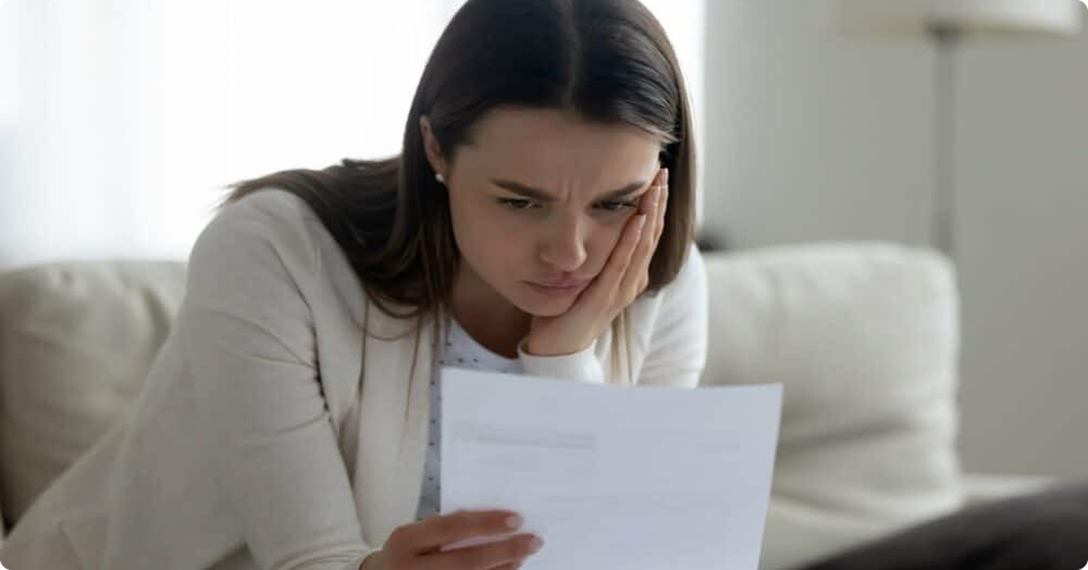 Young white female landlord reviewing bad tenants list